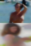 Naked woman wrestling naked man